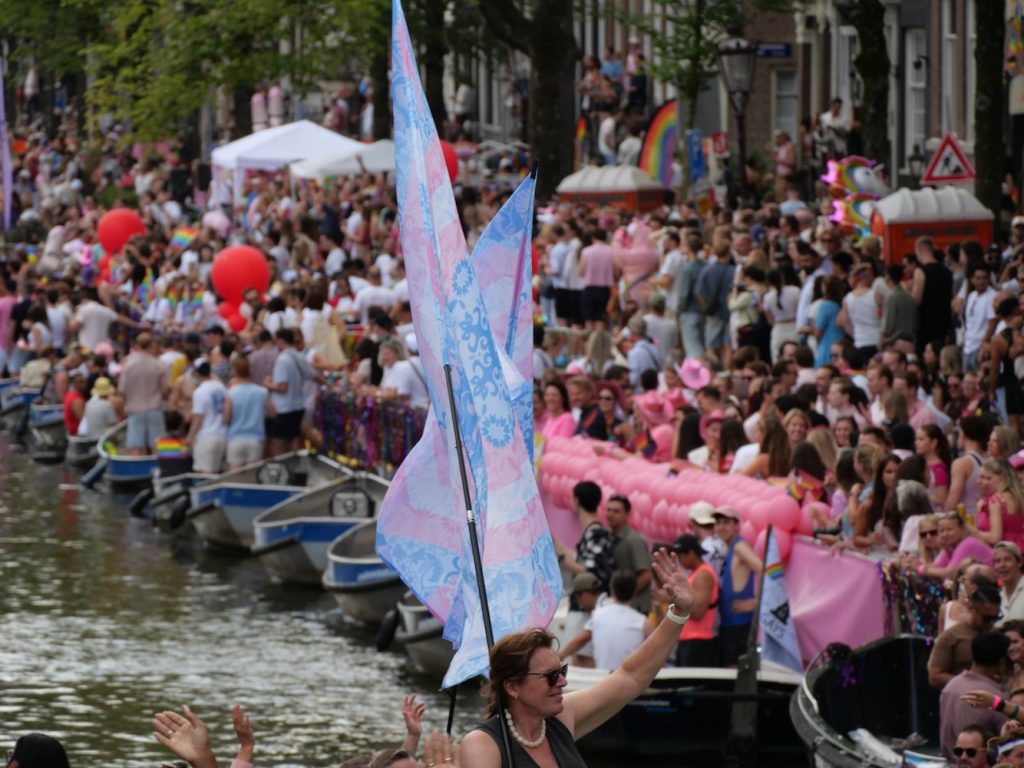 Dutch floral pattern flags during Amsterdam World Pride 2026 Canal Parade.
